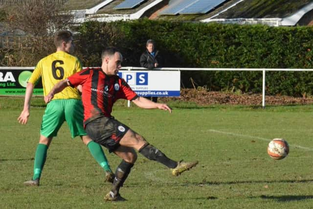 Kane Louis tries his luck at goal. Hailsham Town v Haywards Heath Town. Picture by Grahame Lehkyj