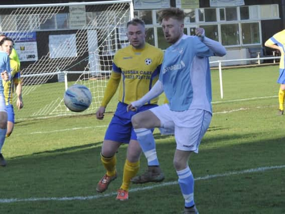 Wayne Giles lays the ball off during Bexhill United's defeat to Langney Wanderers. Picture by Simon Newstead