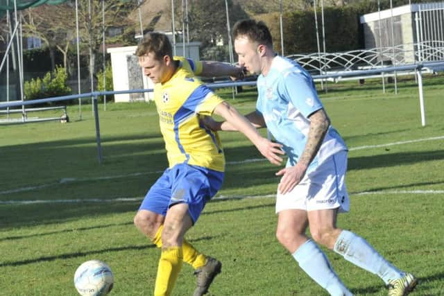 Action from Bexhill United's 8-1 defeat at home to Langney Wanderers on Monday. Picture by Simon Newstead