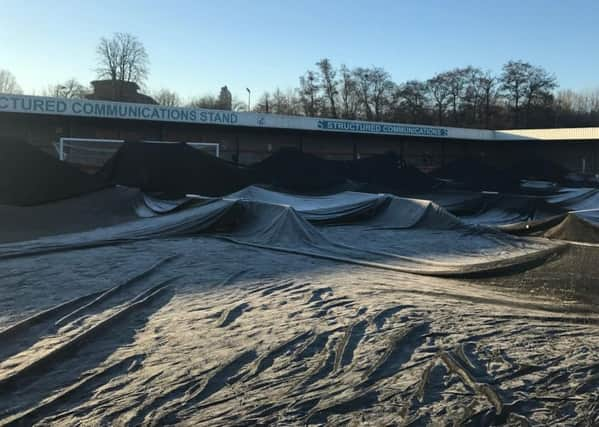 The covers at the Checkatrade.com Stadium covering the pitch before the Portsmouth game was postponed SUS-170123-202430002