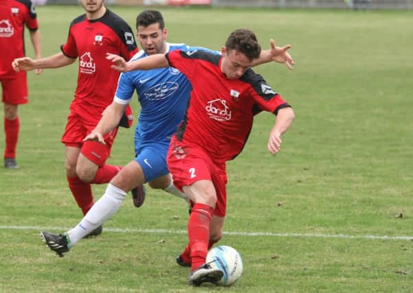 Joe Dryer (blue shirt) hit a hat-trick in Shorehams win at Peacehaven on Saturday. Picture: Derek Martin DM16150883