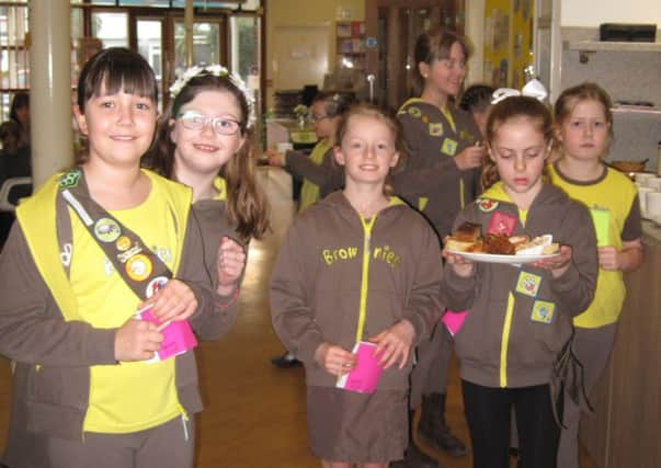 Current Brownies at 11th Worthing handed round plates of cakes at the packs diamond jubilee tea party