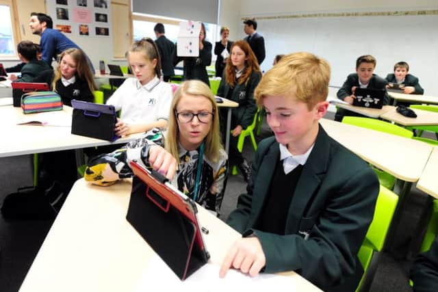 Students showing the Swedish teachers how they use the ipads