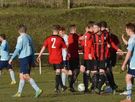 Heath celebrate Max Miller's goal. Worthing United v Haywards Heath Town. Picture by Grahame Lehkyj