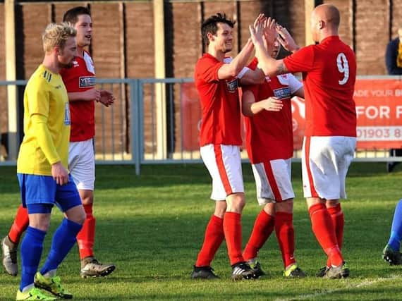 Asa Nicholson celebrates after firing Arundel ahead on Saturday. Picture: Stephen Goodger