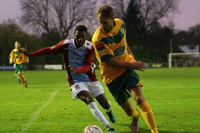 Kiernan Hughes-Mason closes down a Horsham opponent during the 1-1 draw in the reverse fixture. Picture courtesy Scott White