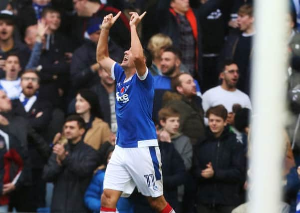 Gary Roberts celebrates scoring earlier this season to ignite scenes of joy among the Fratton faithful