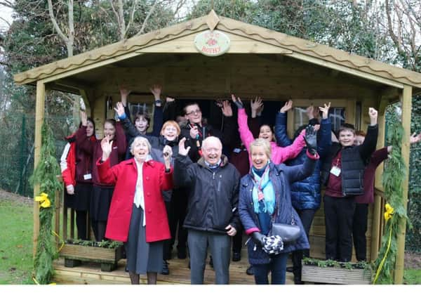 Pictured are John Lamplugh accompanied by Christine and Pat from the Isobel Blackman Foundation in front of happy members of Robertsbridge Community Colleges gardening club