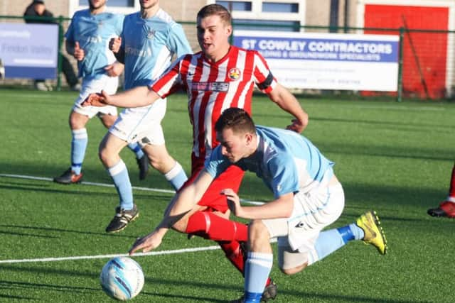 Kenny Butchers tussles for possession. Picture by Derek Martin