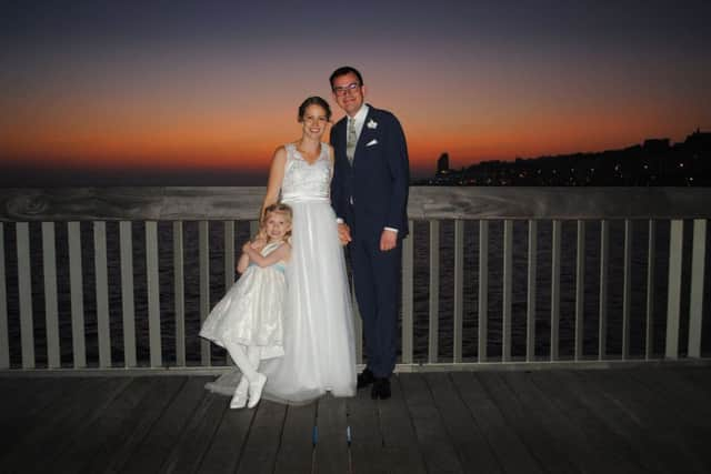 Holly and John Jones with Holly's daughter Ilya who was the flower girl. Photo by Simon Booth Photography SUS-170222-145154001