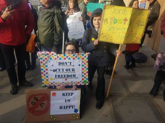 Protestors outside the budget meeting at Hove Town Hall SUS-170223-183029001