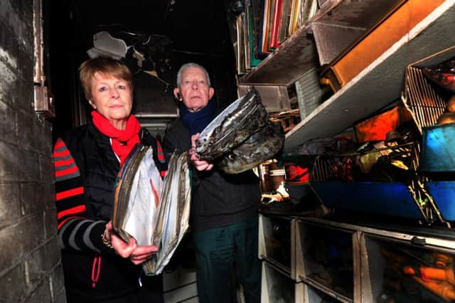 Ted and Wendy Liddle in the remains of their utility room.ks170113-1