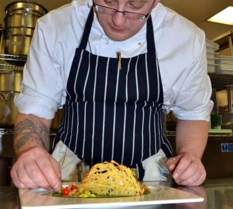 Gabriel Florea adding the finishing touches to his signature dish