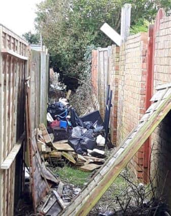 The alleyway has been a dumping ground for fly-tipping for years, say residents