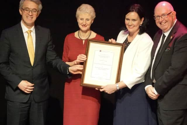 Chichester College principal Shelagh Legrave OBE receiving the eduction 'Oscar' on behalf of Theatre Inc.