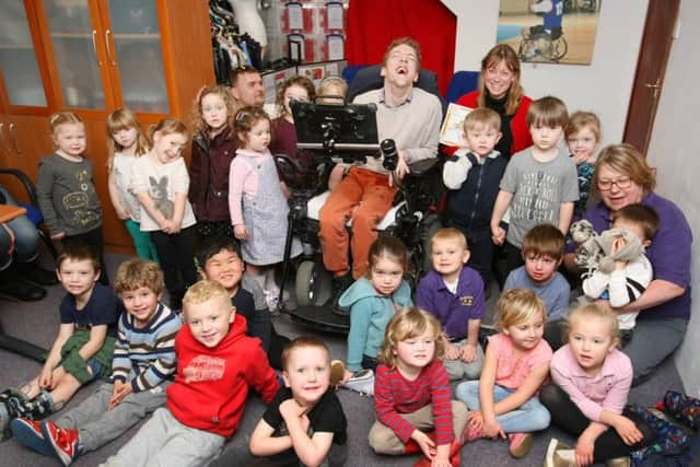 JustDifferent founder Toby Hewson and bookings and community administrator Sarah Robinson with the children from Walberton Pre-School. Picture: Derek Martin DM17312190a