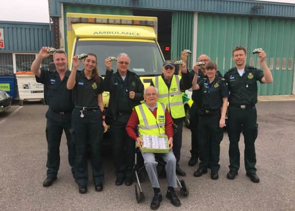 The Littlehampton Lions have donated sponge ambulance toys to the local ambulance station in East Street. Pictured (centre) are John Taylor, 79, and Norman Blackmore, 85 from the Lions group and paramedics, including Brett Walford, 47 (far left) and Paul Harris (third from right).