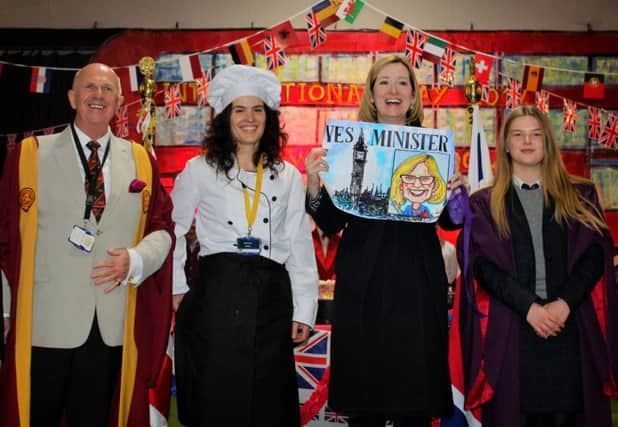 Sean Cassidy and Maria Garcia, teaching staff at Buckswood School, Amber Rudd and Head Girl Victoria Gander