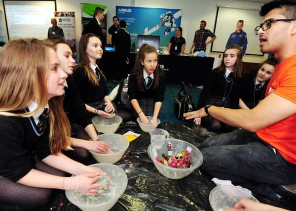 Students making playdoh at a session organised by GSK. ks170148-9