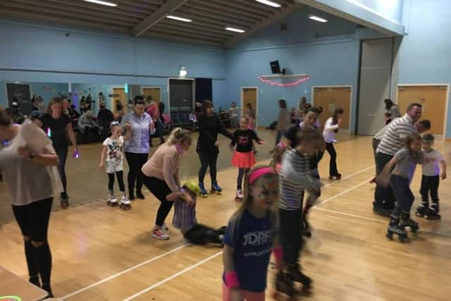 The participants enjoy the roller disco