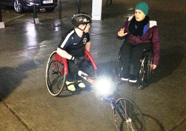 Nathan Freeman gets some wheelchair racing tips from Baroness Tanni Grey-Thompson