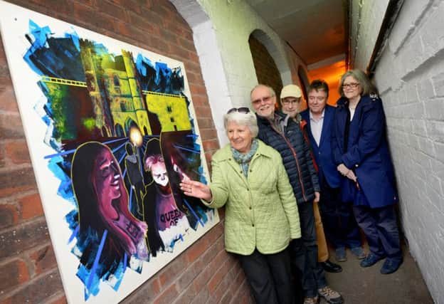 Unveiling of artwork down the twitten that leads from Mount Street car park to the High Street, Battle. SUS-170328-114645001