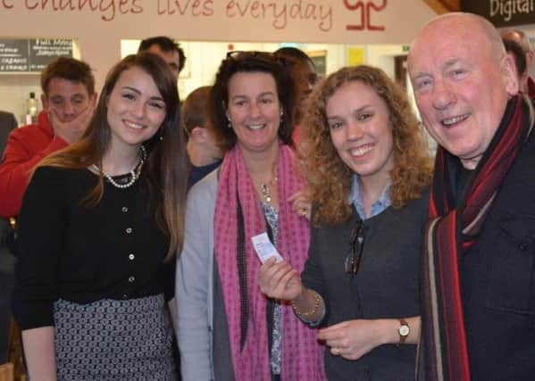 Christopher Timothy drew the winner at The Aldingbourne Trusts raffle event. He is pictured here with Chloe Sexton of Henry Adams Holiday Lets, Abigail Rowe of the trust, and raffle organiser Laura Nix of Henry Adams Holiday Lets, who is holding up the winning ticket