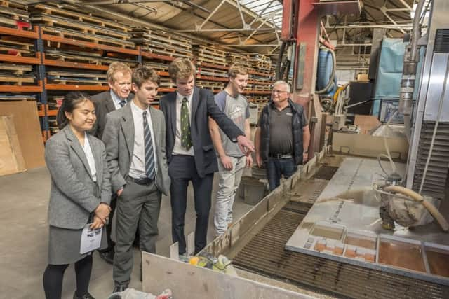 Students working at the Cirrus Laser factory. Picture: Paul Noble