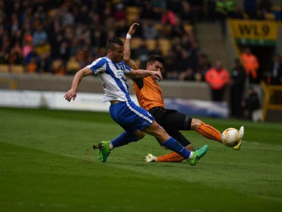 Brighton & Hove Albion striker Tomer Hemed unleashes his effort that crashed against the bar in the first half