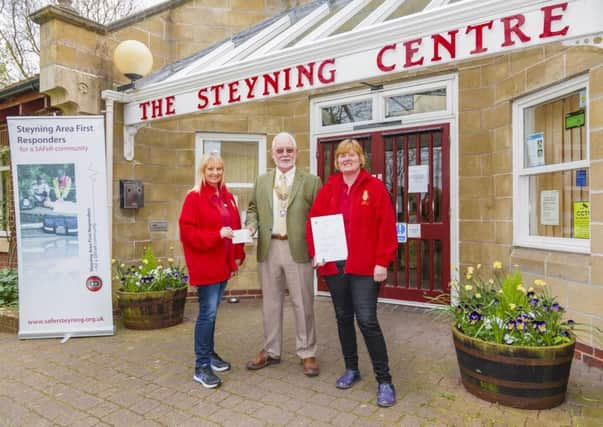 Rotary president John Dibb presenting a Â£1,000 cheque to team leader Christine Peters, alongside Alison Law. Picture: Martin Leigh-Pollitt