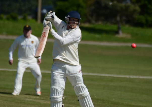 Malcolm Johnson is forced up onto his toes during Bexhill's cup win at home to Glynde & Beddingham last weekend. Picture courtesy Andy Hodder