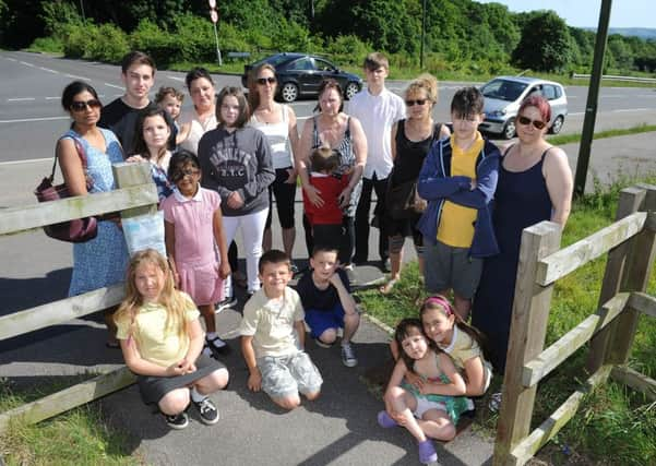 Concerned residents by the public access way which is near a busy bypass. Picture: Steve Robards