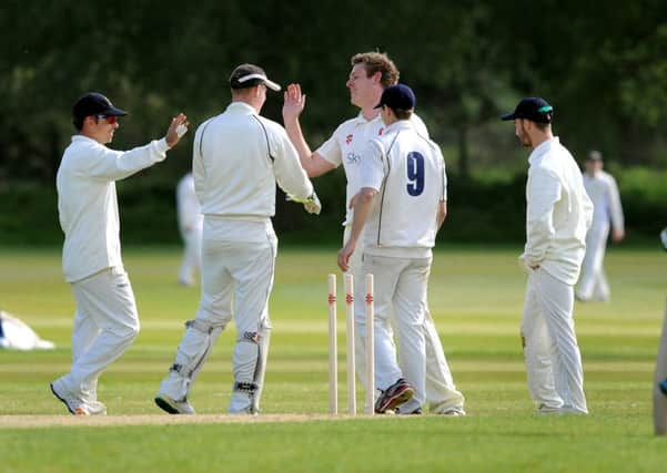 Cricket: Horsham (fielding) v Cuckfield. Jonathan Whiting takes a wicket. Pic Steve Robards SR1710805 SUS-170516-095612001