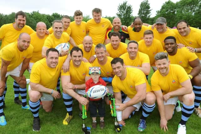 Southern Hemisphere rugby players with Sonny. Picture: Steve Robards