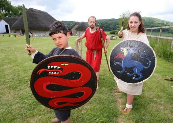 DM17526925a.jpg Bignor Roman Villa Living History event. L to R Jack Labelle-Hughes 9, Mark Goble and Nina Mander-James. Photo by Derek Martin SUS-170406-153159008