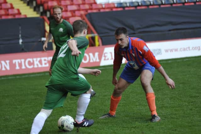 Battle Baptists full-back Ian Rafati blocks the path of an opponent.