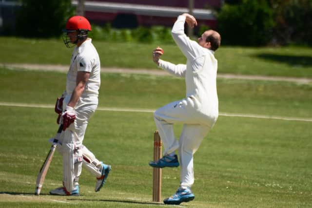 Nick Peters bowling for Bexhill against Nomads. Picture courtesy Andy Hodder