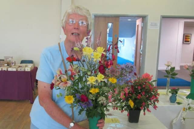 Julia MacCulloch with her wonderful vase of flowers. Picture: Barry Hillman