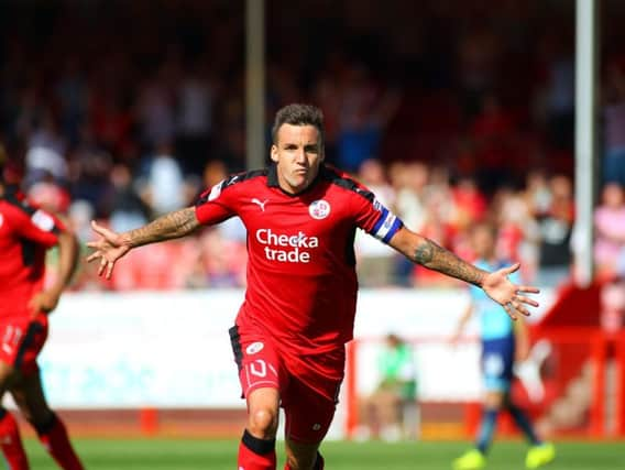 Jimmy Smith celebrates a goal on the opening day last season