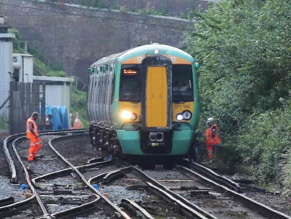 Network Rail engineers at work near Preston Park, after reports that train tracks had melted in the heat (Photograph: Eddie Mitchell)