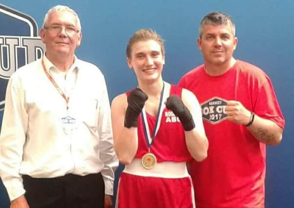 Claudia Havranek with her coaches after her Hariney Box Cup win