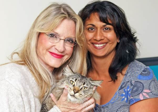 DM17631237a.jpg Beatrice Welles and Nemi Fisher who found Beatrice's cat Teddy after being missing for two months. Photo by Derek Martin. SUS-170628-202815008