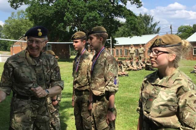 The Lord Lieutenant of East Sussex presents Cadet L/Cpl Constance Stockman with her winners medal