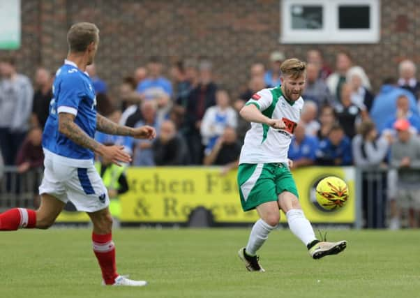 Trialist Tom Bird clears from Carl Baker / Picture by Tim Hale