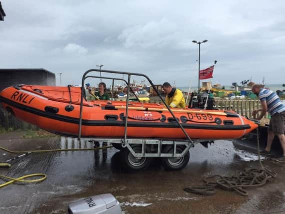 Hastings RNLI inshore lifeboat launching. Photo courtesy of the Hastings RNLI. SUS-170717-112118001