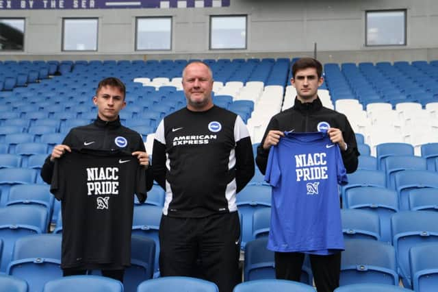 (left to right) Owen Andrews, Guy Butters, who coaches the 11-a-side BTECT team at Albion in the Community, and Owen Muller. SUS-170718-125832001