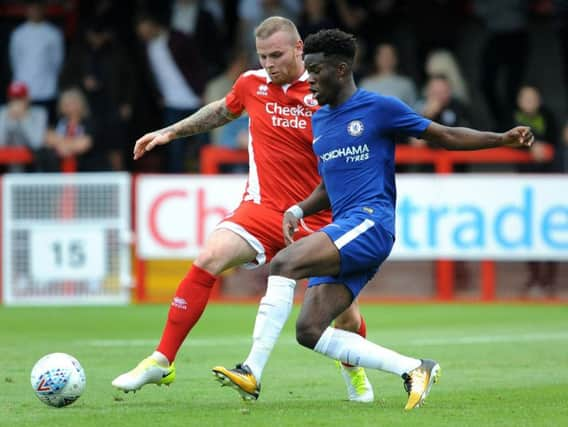 Crawley's Connolly puts in strong tackle on Chelsea starlet Ike Ugbo during 1-1 draw. 
Picture by Steve Robards.