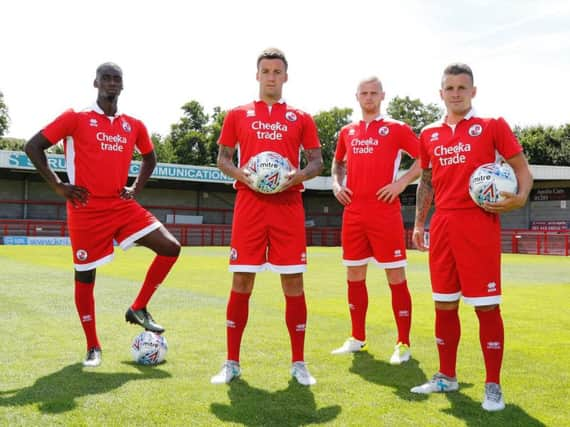 Reds players Enzio Boldewijn, Jimmy Smith, Mark Connolly and Dean Cox model the club's new kit.
Picture by James Boardman/Telephoto images