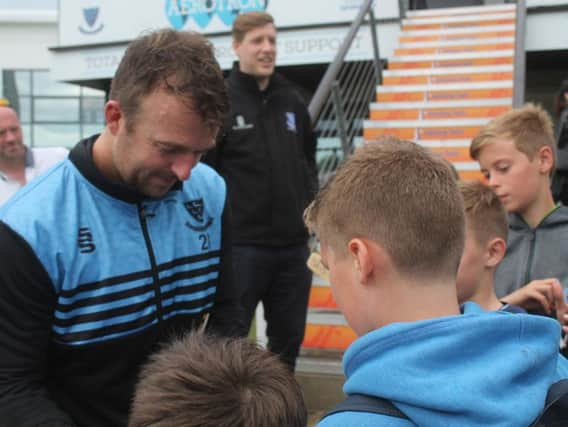 Chris happily chats to fans post match