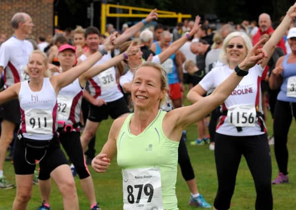 Barnes Green half marathon and 10k run. Barnes Green Village Hall, Muntham Drive.  Half Marathon warm up SUS-160925-205259008